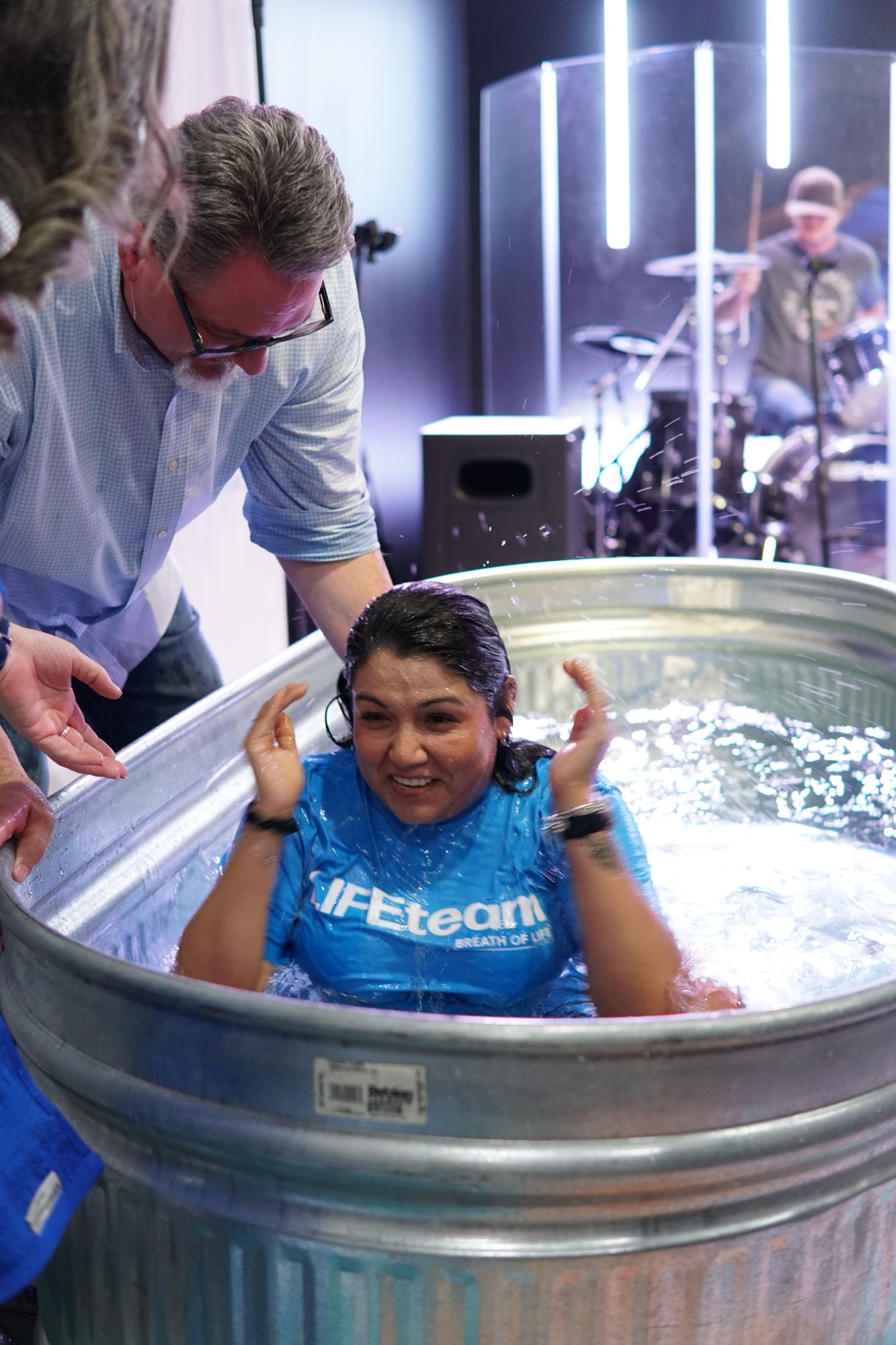 Pastor Justin baptizing a new believer