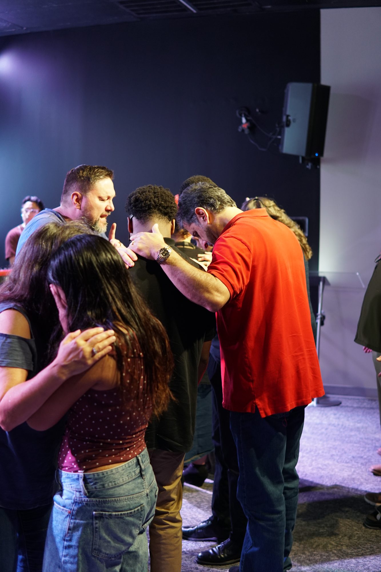 Praying together at Breath of Life Church Impact Youth